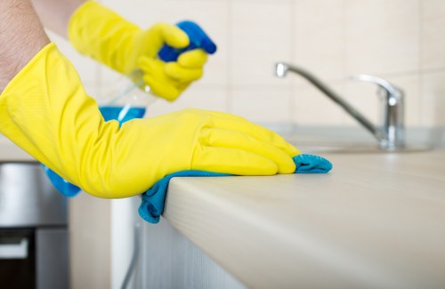 Cleaner using safe hygiene practices during carpet cleaning